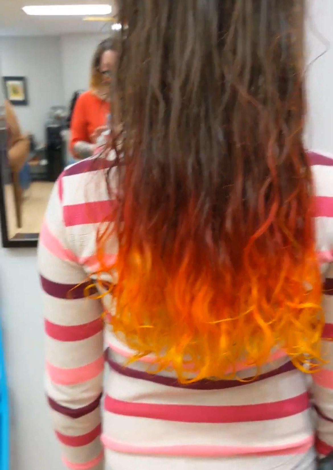 long brown hair that fades red orange and yellow